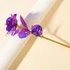 flores coloridas de oro y morado de 24 cm
