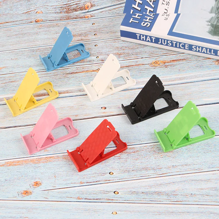 Foldable universal adjustable mobile phone holder