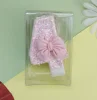 Candela numero 4 con fiocco rosa