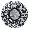 Bouchon d'huile de vache noir et blanc