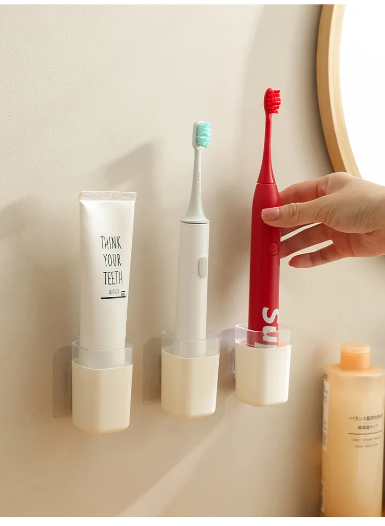 Bathroom perforation-free electric toothbrush storage rack Bathroom wall paste toothpaste toothbrush wall mounted storage rack supplier