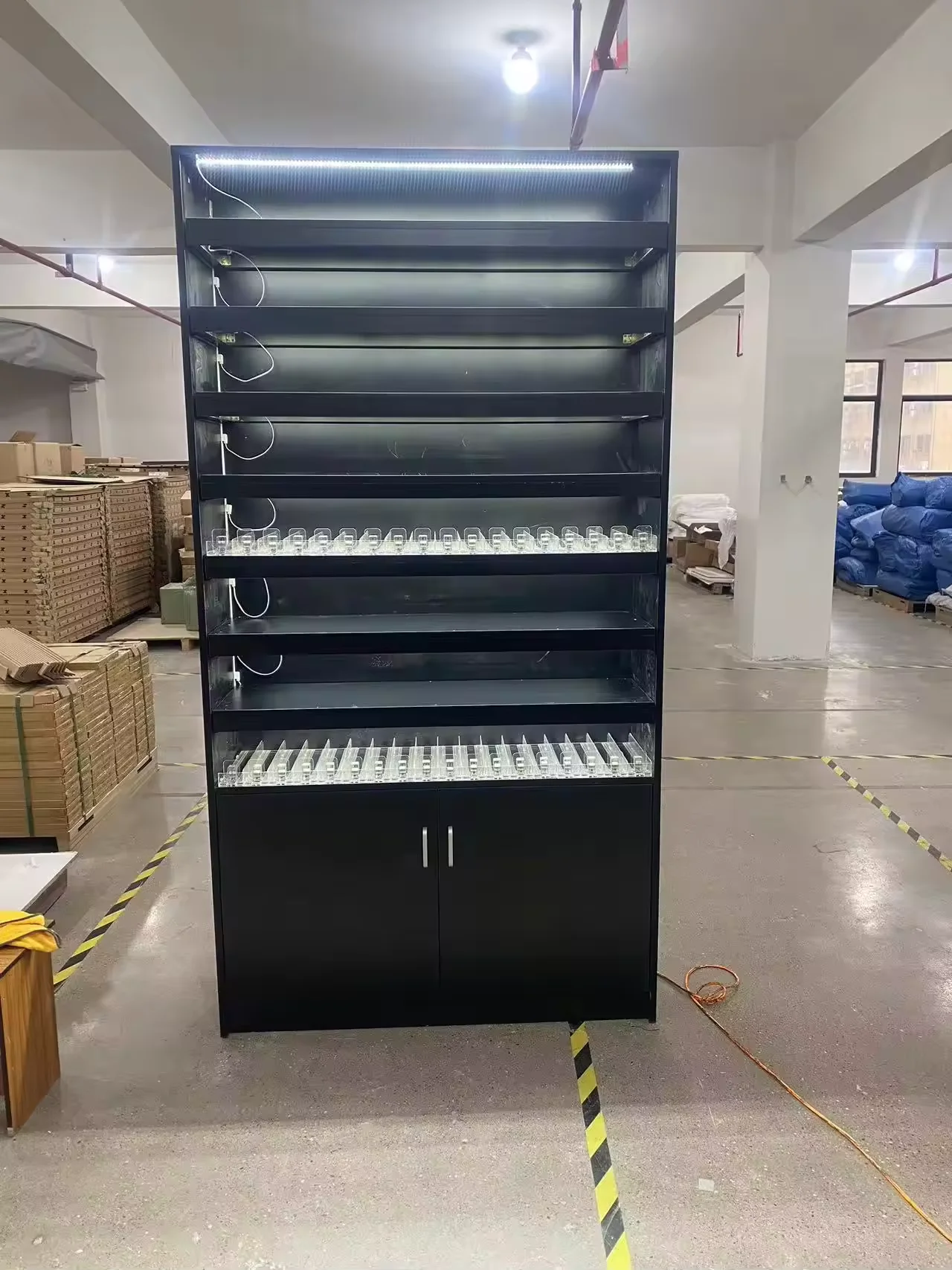 Wall Display Unit With Cigarette Pushers and Storage