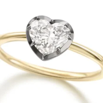 14K yellow gold with blackened oxidized white gold around a 6mm Heart shape moissanite Size 9 and the band is 2mm wide Ring