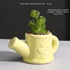 Maceta pequeña con regadera-verde