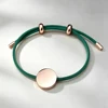 Cordoncino verde + ciondolo in oro rosa