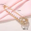 Broche fleur et perle