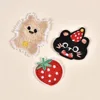 Black cat, strawberry, and yellow dog embroidery patch