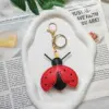 Red plus key chain