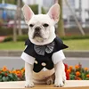 Black suit with plaid bow tie