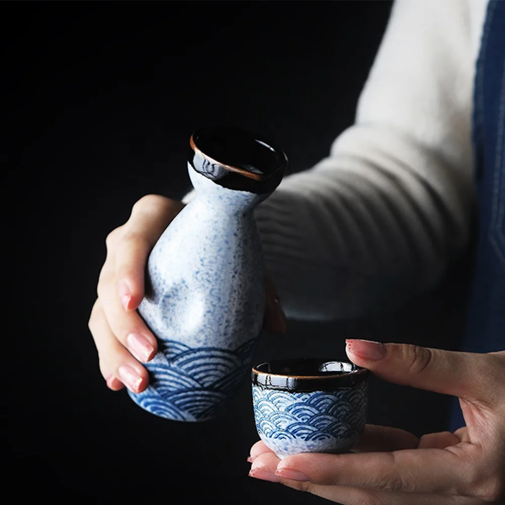 Japanese Glazed Ceramic Sake Set with Oriental Style Blue Ocean Waves Design Includes Serving Carafe and 4 Sake Cups