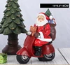 1 Santa Claus riding a motorcycle