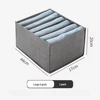 Caja de almacenamiento gris de 6 compartimentos.