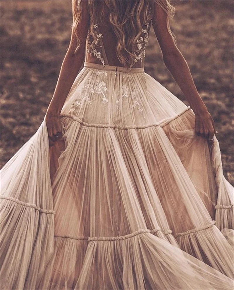 Boho Deep V Neck Sleeveless Backless Bridal Beach Tulle Lace Wedding Dress  - A-Line Champagne Bridal Gown for Elegant Weddings