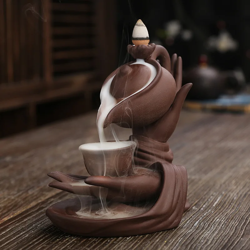 Bruciatore di incenso a riflusso Buddha a cascata con coni di incenso