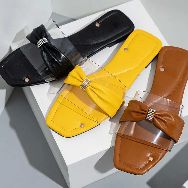 Sandalias planas de raso negro con detalle de lazo . PURA LOPEZ