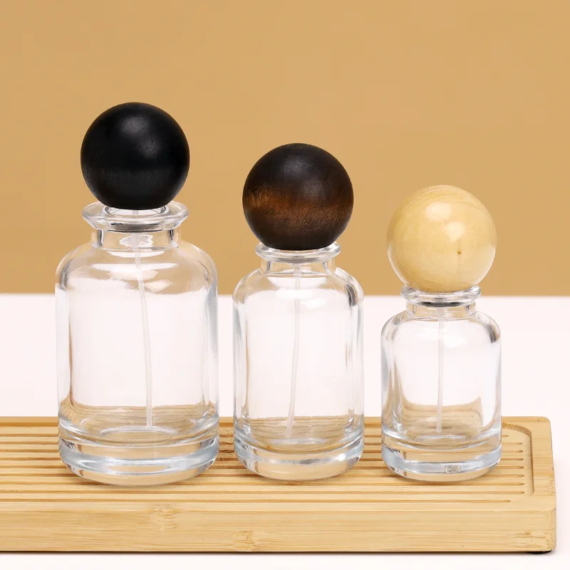 Custom Unique Round 30ml 50ml 100ml Clear Luxury Empty Glass Spray Perfume Bottles Packaging Glass Bottle With Ball Cap
