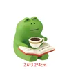 กบอ่านหนังสือกาแฟ