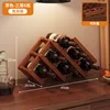 Three-tiered folding wine rack in brown (holds 6 bottles)