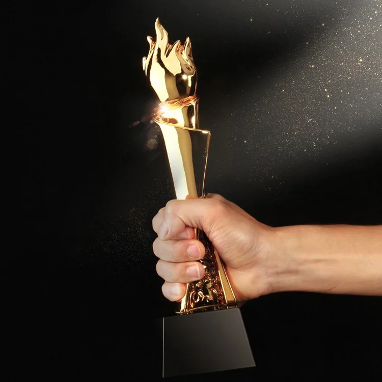 OEM / ODM Sport Crystal Trophy Cheap Creative Flame Shape Luxury Custom Lettering Metal Trophy With Black Base