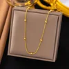 Collana a catena con perline a forma di serpente, oro 14 carati.
