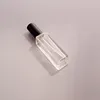 Botella transparente cuadrada con tapa negra
