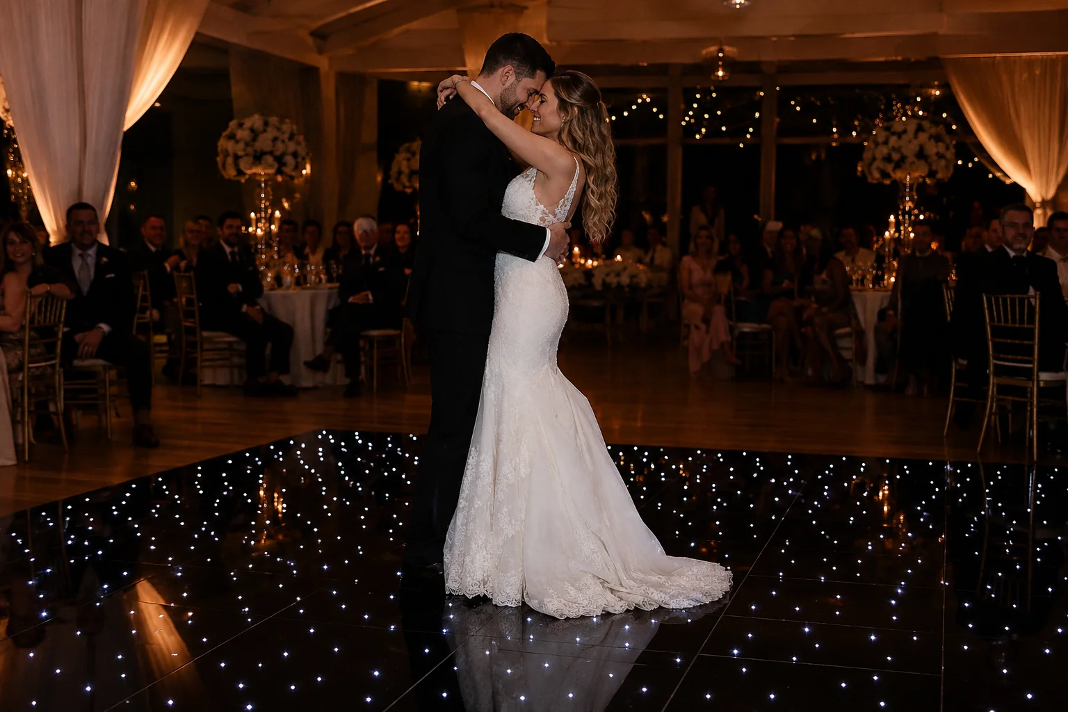 Couple dancing on a star LED dance floor with thousands of twinkling white LED points creating a night sky effect during their first dance