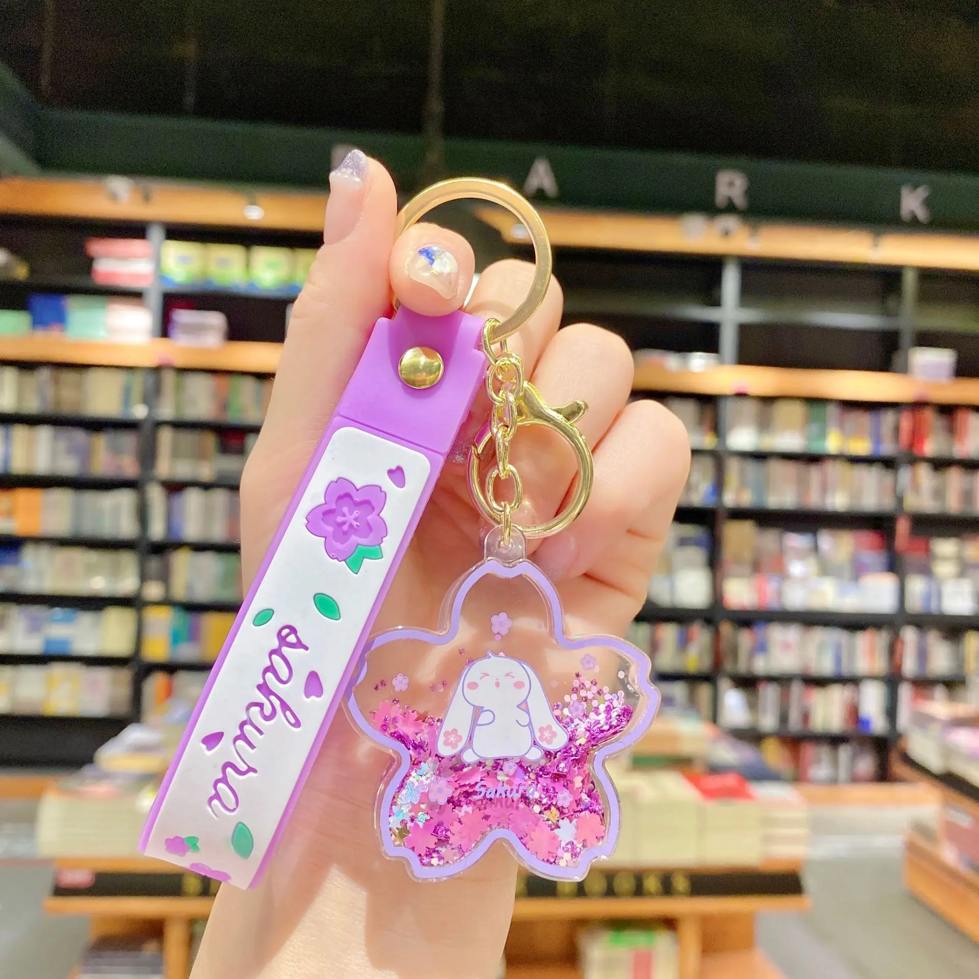 クリエイティブな浮遊桜ウサギキーホルダー、液体オイルウサギが動く