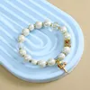 Pulsera de rueda de oración con mantra de seis sílabas - Blanco perla