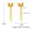 Pendientes de borla con circonita y mariposa dorada.
