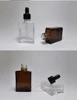 Transparent bottle + black ring + rubber stopper + dropper