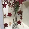 Estrella roja brillante con purpurina, estrella espejada en oro rosa.