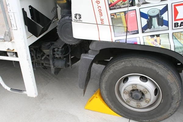 Heavy duty plastic truck trailer wheel chock stop with steel bracket