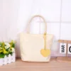 Bolso individual beige [para llevar en la mano]