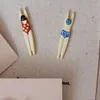Clous d'oreilles en forme de natation (paire)