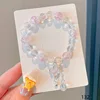 Butterfly bell in iridescent pink