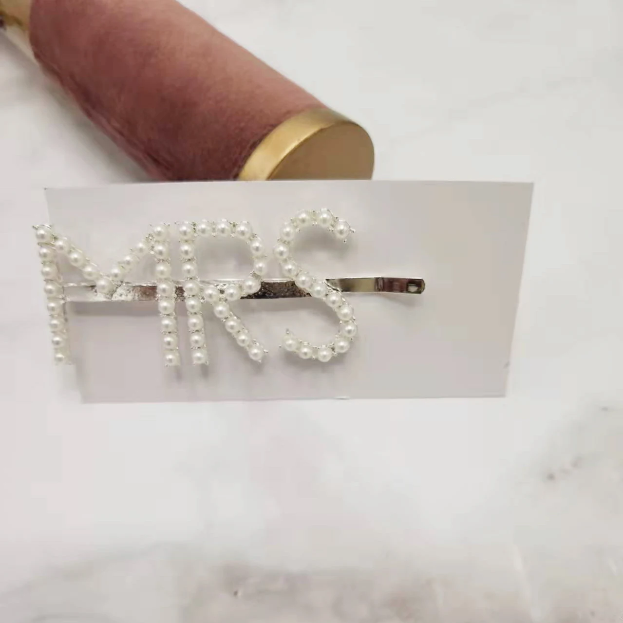 Pawcci Pearl monogram hair clip – bearsupreme