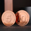 Monedas de desafío chapadas en cobre