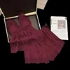 Pantaloncini con bretelle bordeaux con imbottitura