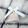 Beige Bag with Blue Ribbon