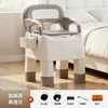 Gray raised indoor squat toilet