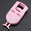 Pink smiley eyelash curler