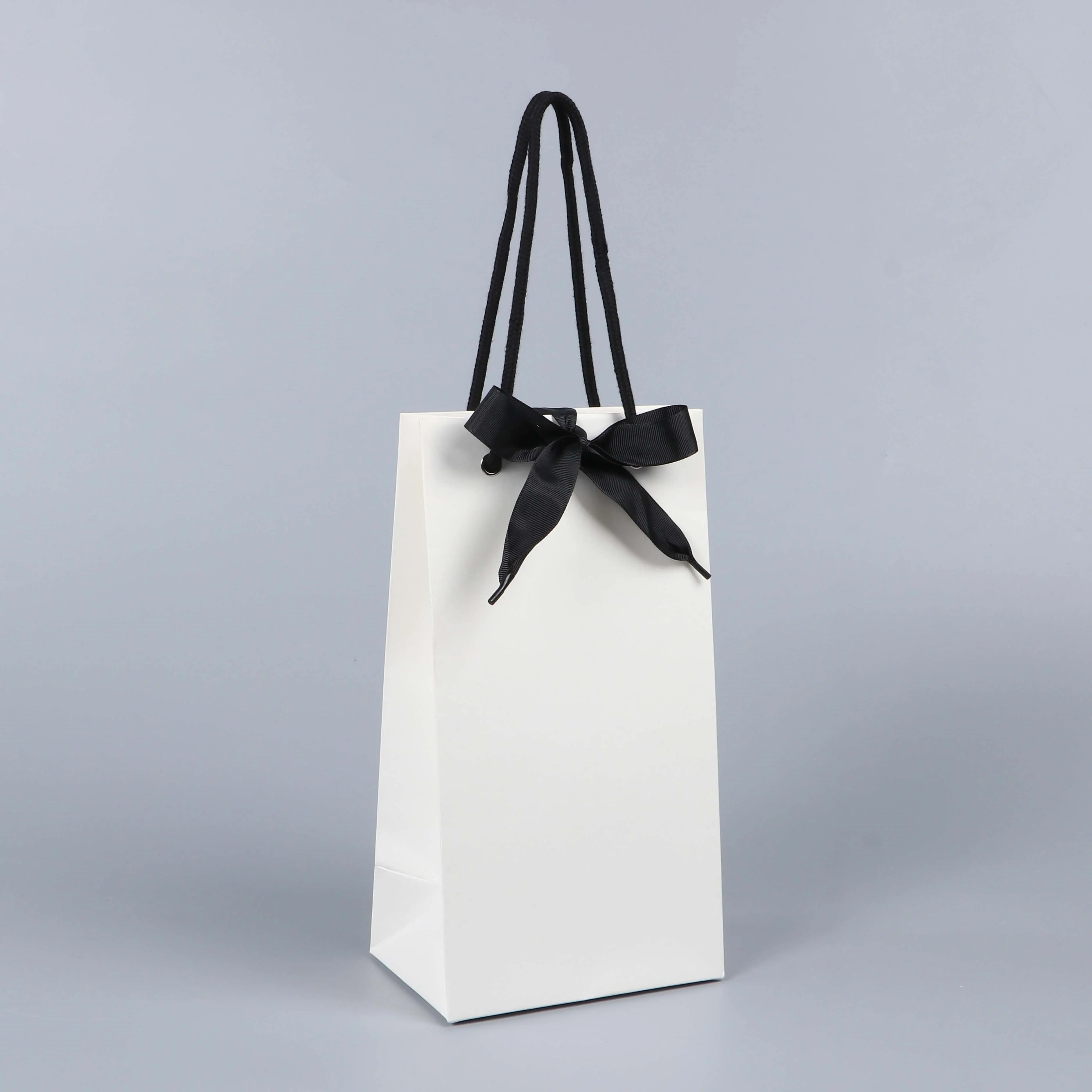 Sturdy Durable Thick White Gift Bag With Black Handle And Ribbon