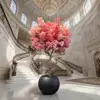 Pink flowers with black pots