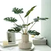Cream petal vase with 9 Monstera leaves
