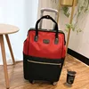 Red swivel wheel single trolley bag