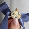 Collana con ciondolo a forma di farfalla blu oro