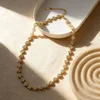 Five white diamonds in gold
