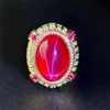 Bague lumineuse étoile à six branches en corindon rouge doré