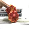 Torre de tornillo de doble capa, degradado naranja a rojo.