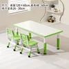 White cardboard green table and two chairs